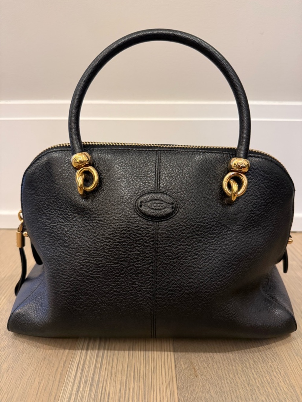 Tod’s Black Leather Dome Handbag with Gold Hardware
